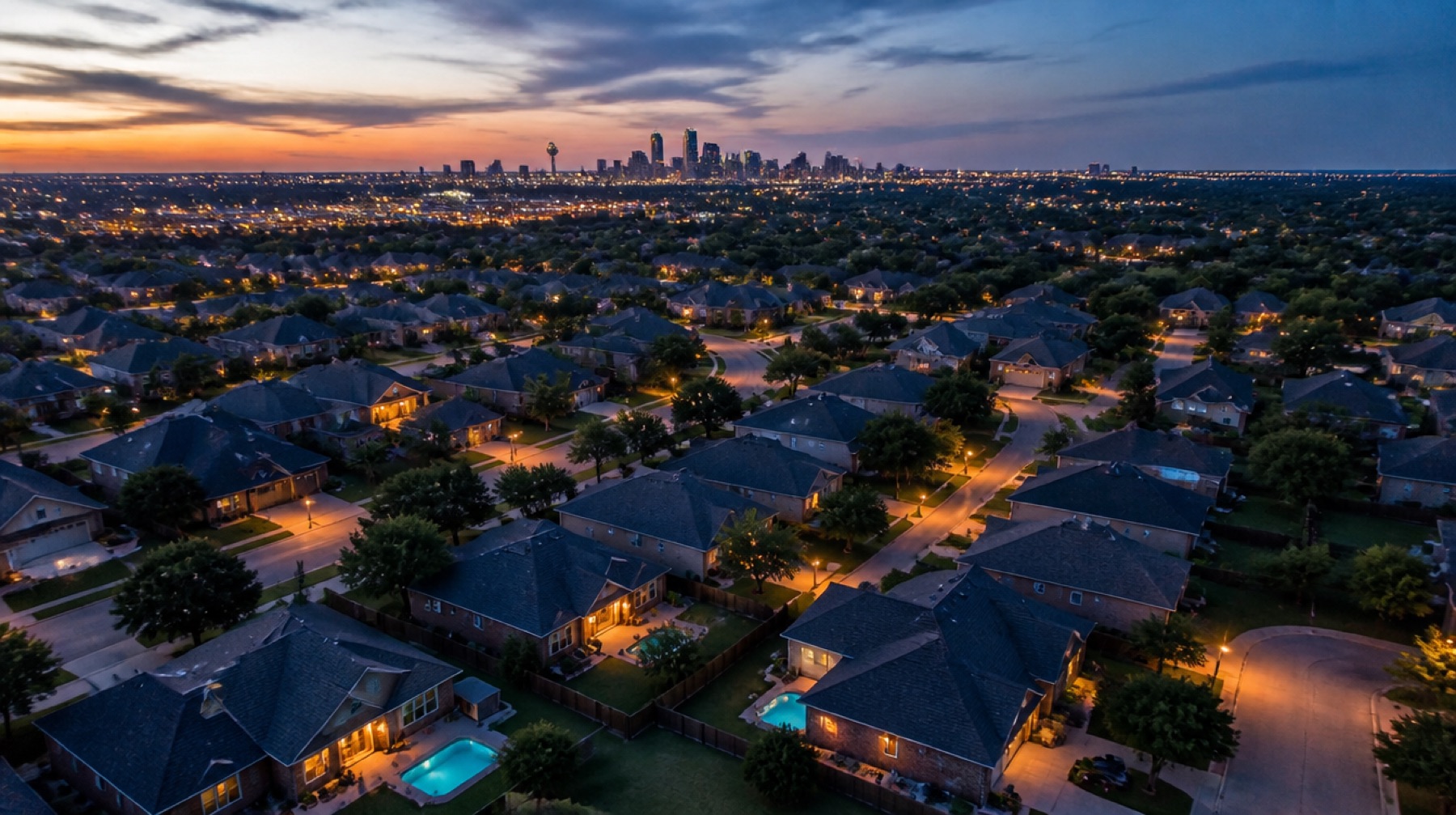 Aerial view of a Dallas–Fort Worth neighborhood at dusk